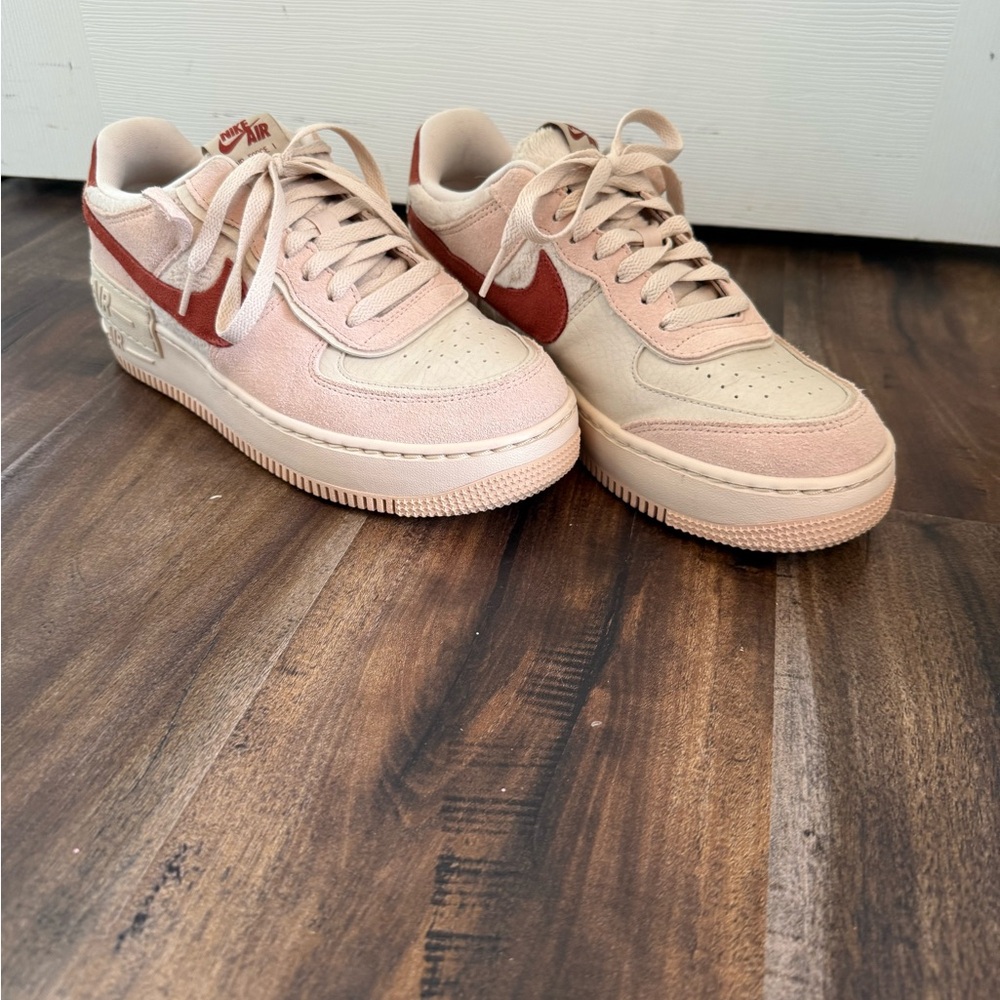 Nike Pink and Red Sneakers with Classic Design